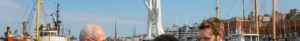 Bustling Portsmouth harbor scene with locals exploring FBC test benefits under Spinnaker Tower and vibrant ships.