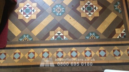 worn Victorian Minton hallway floor in Walsall before restoration
